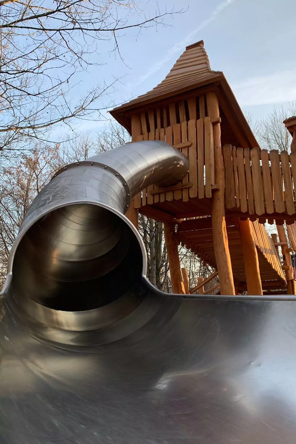 Playground steel tube slide in the park