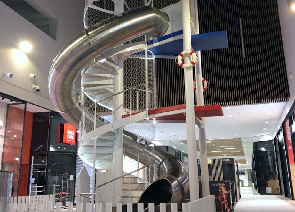 Indoor steel slide in a shopping mall