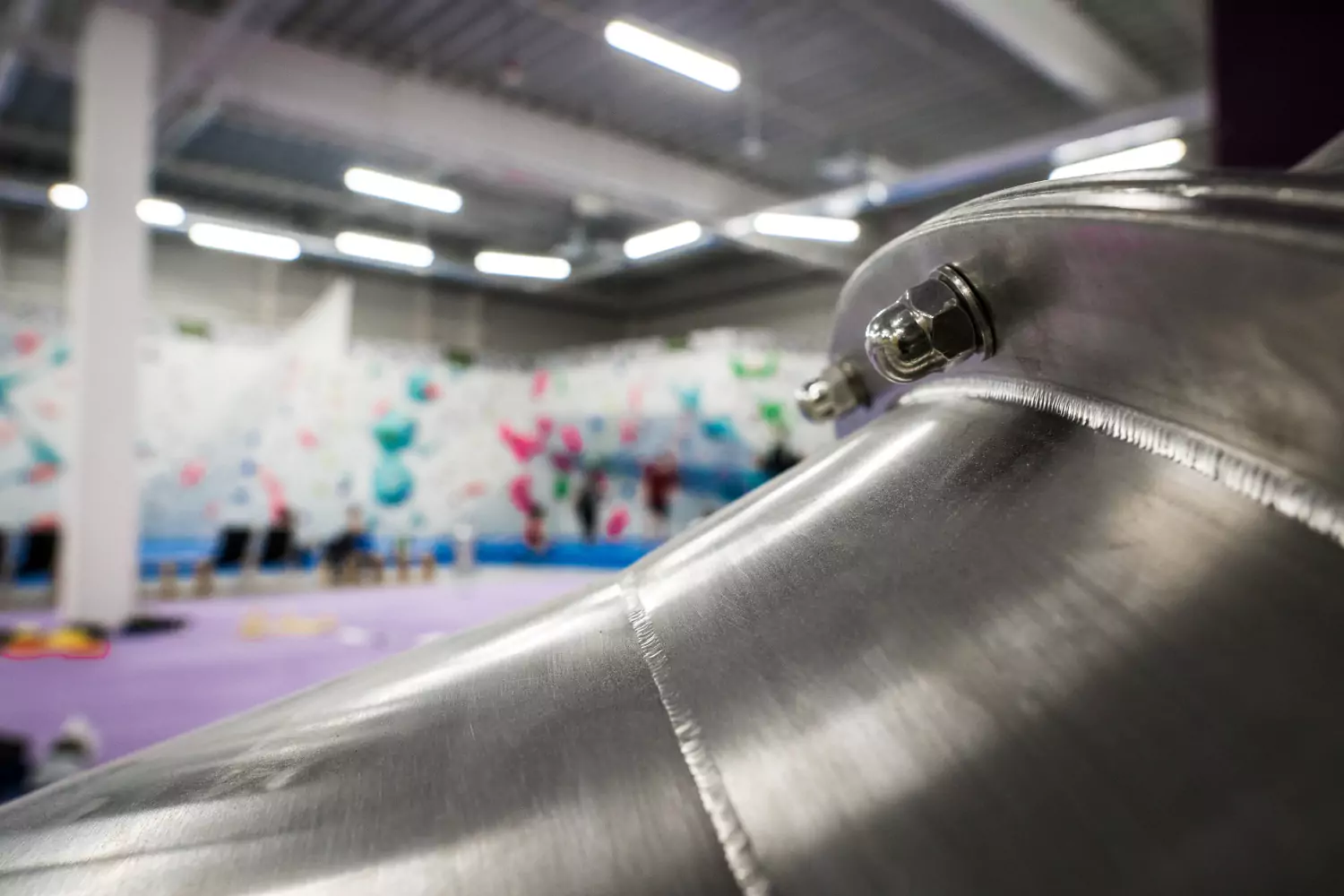 Steel slide with climbing walls in an indoor sport hall